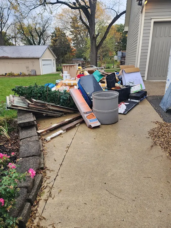Dumpster being loaded with debris for 30 Yard Dumpster Rental in North Collins